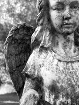 Guardian Angel Female Figure in black and white photograph weathered by time, harsh weather and years of exposure to the elements stands firm reminding us that there is a life outside of this one called Eternity where we can go to be with Jesus and our loved ones who have passed on before us 