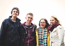portrait of teens standing together outdoors 