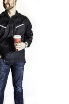 man holding a coffee travel mug