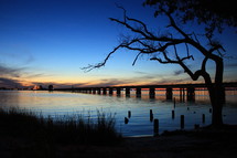 bridge across a river at dusk 
