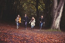 teens walking together outdoors in fall 