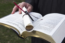 diploma on a Bible