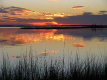 sunset reflecting on still water 