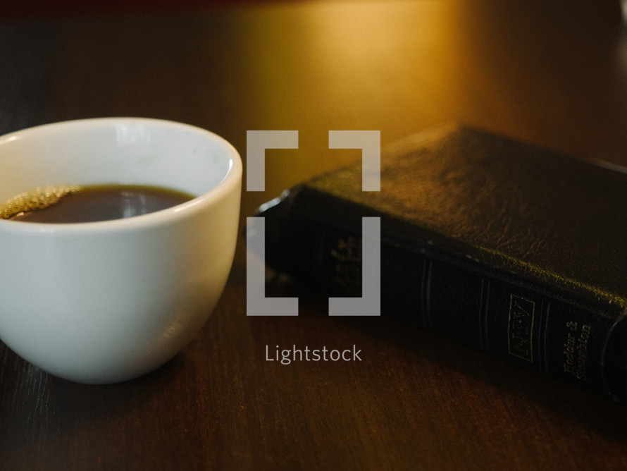coffee and Bible on a table 