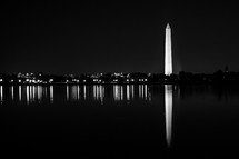 Washington Monument at night reelected in water