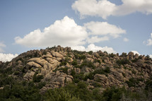 rocks on a mountain top and mountainside 
