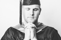 Graduate praying.