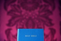 Bible on floral fabric.
