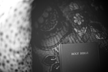 Bible on floral fabric.