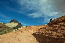 man climbing a rock in Nevada
