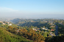 A view of a hilly residential neighborhood.