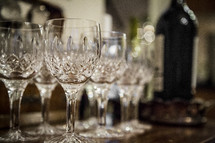 empty wine glasses and wine bottle, holiday parties 