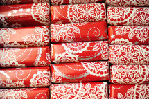 stacked wrapped red and white gift boxes 