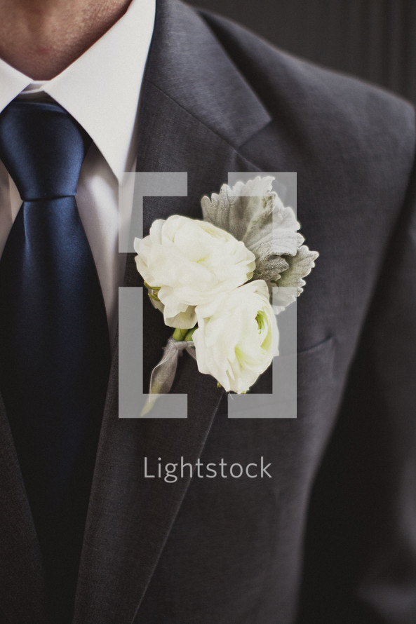 A close-up of a man's boutonniere 
