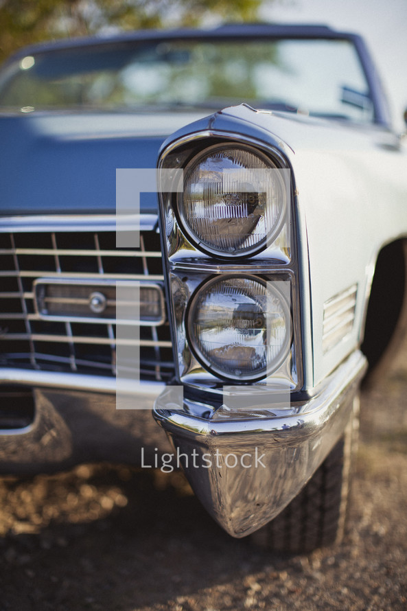 Close up on a the headlights of a classic car