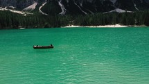fishing boat on a turquoise lake 