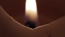 a fluttering flame on a candle 