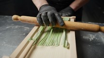  Green Spaghetti Creation On A Wooden Traditional Tool
