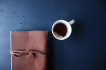 leather bound Bible and coffee cup 