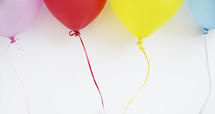 colorful balloons on string 