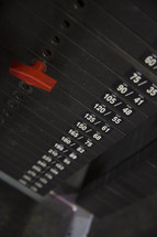 weights on fitness equipment at the gym