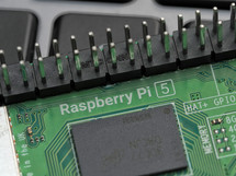 Galati, ROMANIA - November 10, 2023: Close-up of a Raspberry Pi 5 on a laptop keyboard. The Raspberry Pi is a credit-card-sized single-board computer developed in the UK