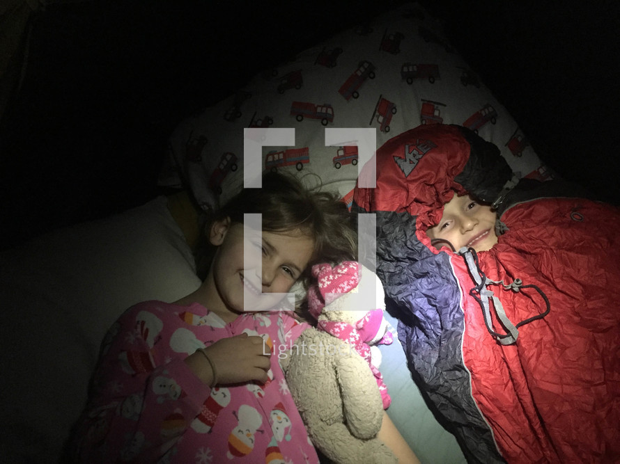 kids sleeping in a tent 