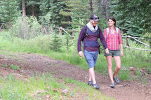 a couple hiking on a trail 