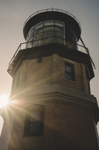 a lighthouse at daybreak 