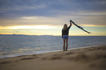woman standing on a beach 