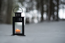 a lantern in the snow