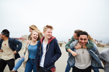 group of teens walking through a parking deck 