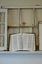 opened Bible on a mantel 
