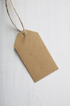 A blank, brown paper gift tag.