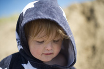 head shot of a toddler boy in a hoodie 