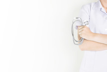 healthcare worker holding a stethoscope 