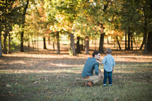 a father and son outdoors in fall 