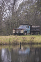 old farm truck and pond 