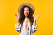 Pretty woman shows triumph yes gesture of victory, she achieved result, goals. Girl glad, happy, surprised excited happy lady on yellow background. Jackpot concept. High quality photo