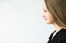 side profile of a teen girls face 
