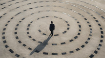 A man standing alone in a circular pattern. 