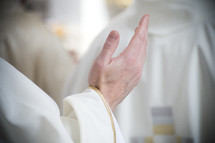 priests hand in blessing