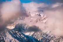 Snowy mountains in clouds