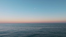 moon on the horizon over the sea