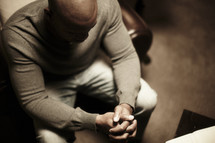 An African American man prays during his quiet time.
