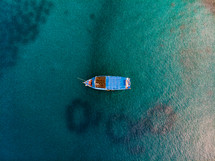 boat floating on turquoise waters 