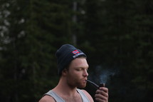 a man smoking a pipe 