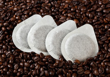 coffee pods on coffee beans 