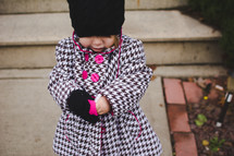 toddler girl bundled up for chilly weather 
