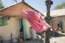 school uniform on a clothesline in a village 